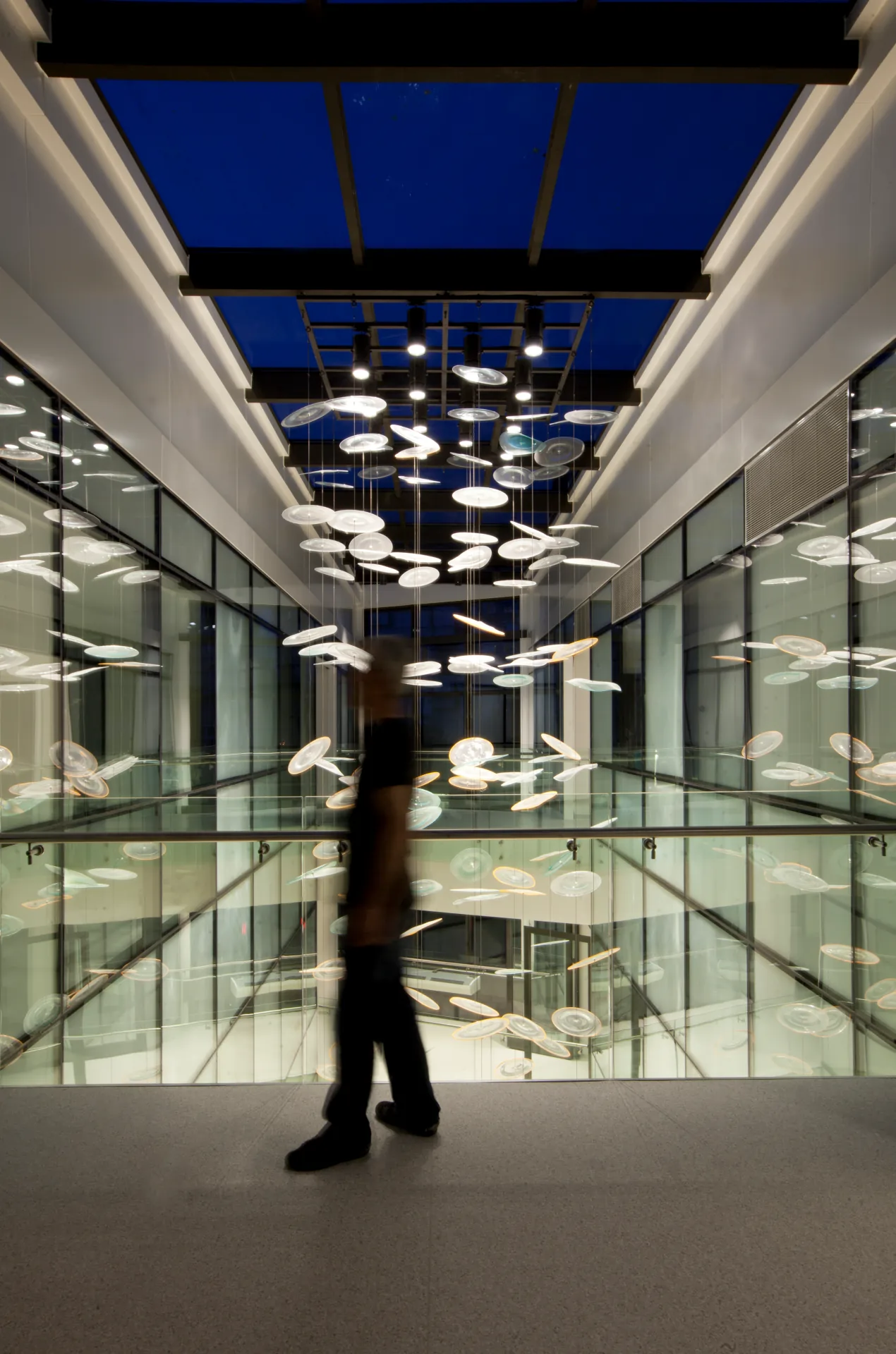 Glass atrium with suspended lighting seen from the ground floor of NB Hospital, Acıbadem, Kadıköy